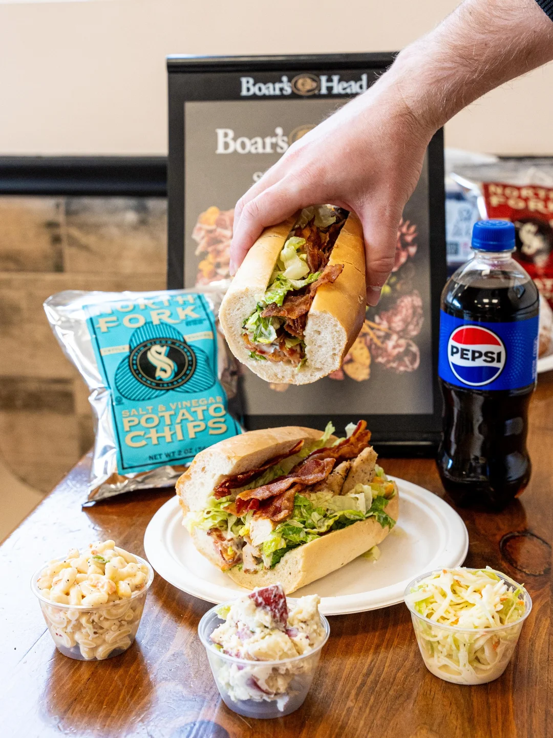 Loaded deli sandwiches with fresh side salads