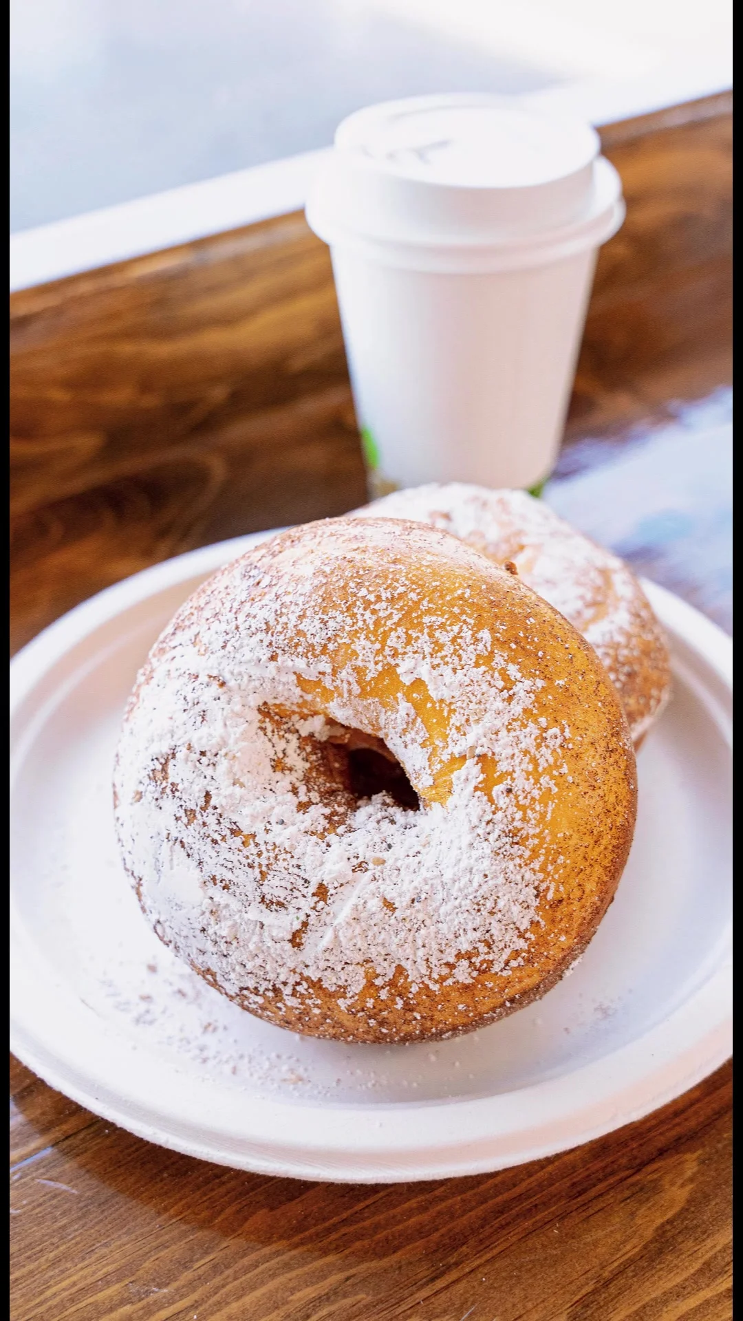 Powdered pastry with a cup of coffee